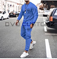 a man is walking down the street in a blue jogging suit